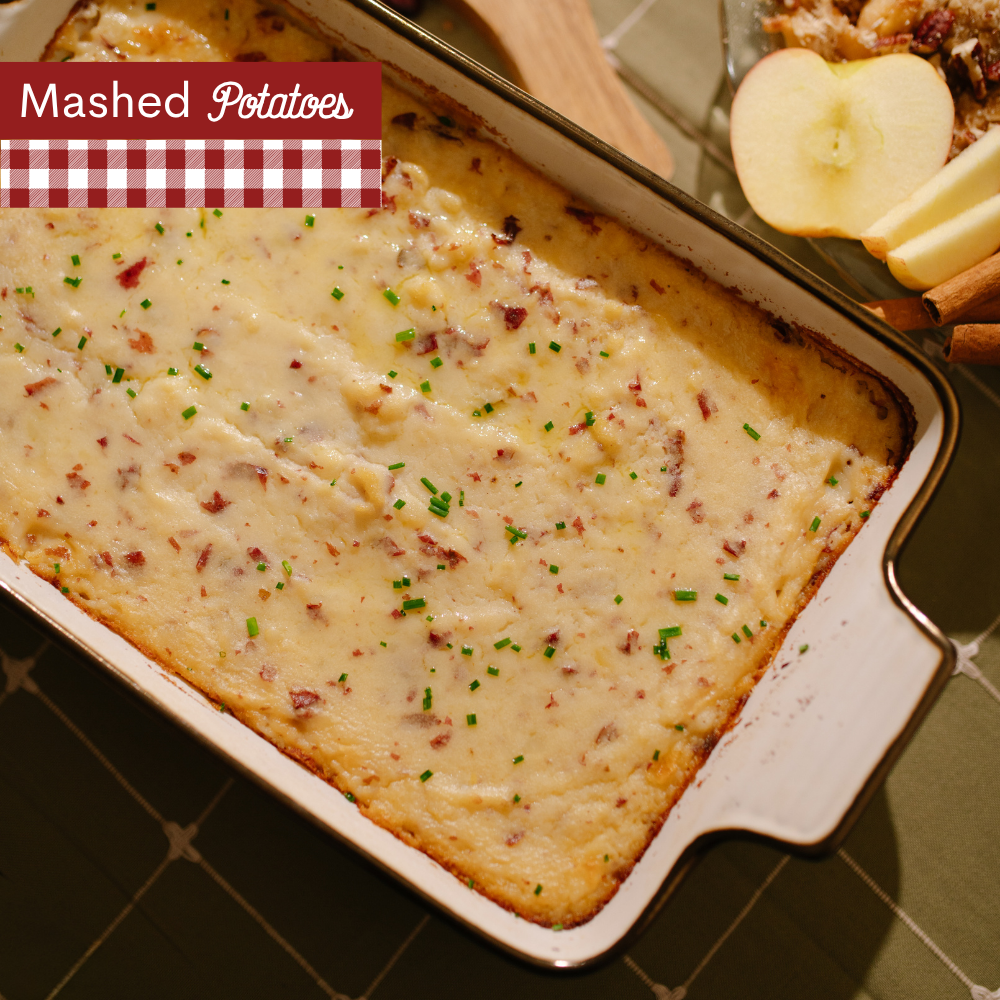 Mashed potatoes topped with chives in a white dish with A red-and-white gingham banner at the top left reads 'Mashed Potatoes'.
