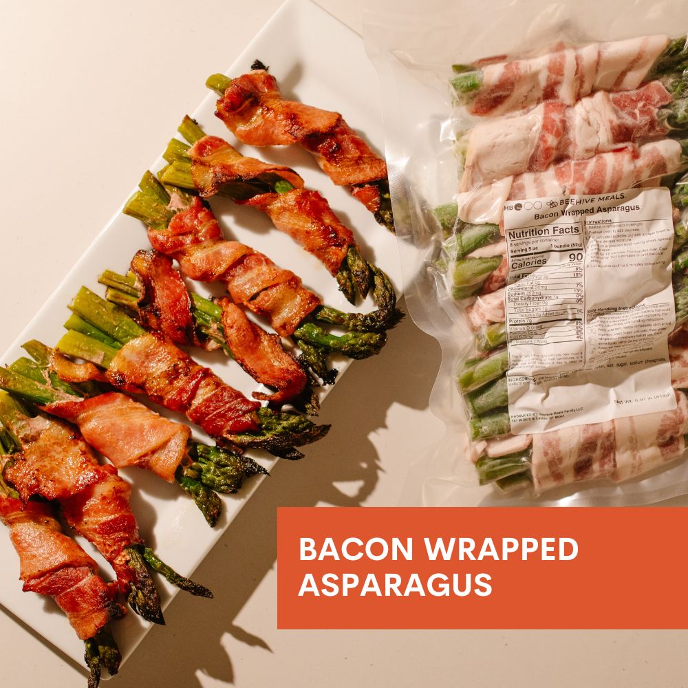Bacon wrapped asparagus on a plate with packaging in the background
