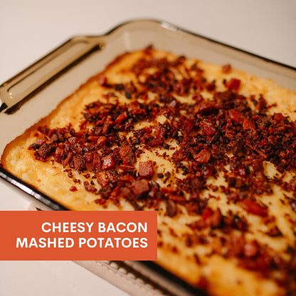 Cheesy bacon mashed potatoes on a baking tray with text overlay.