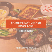 Table with various dishes and a promotional banner for Beehive Meals Father's Day dinner that reads "Father's Day Dinner Made Easy. Order Now." 