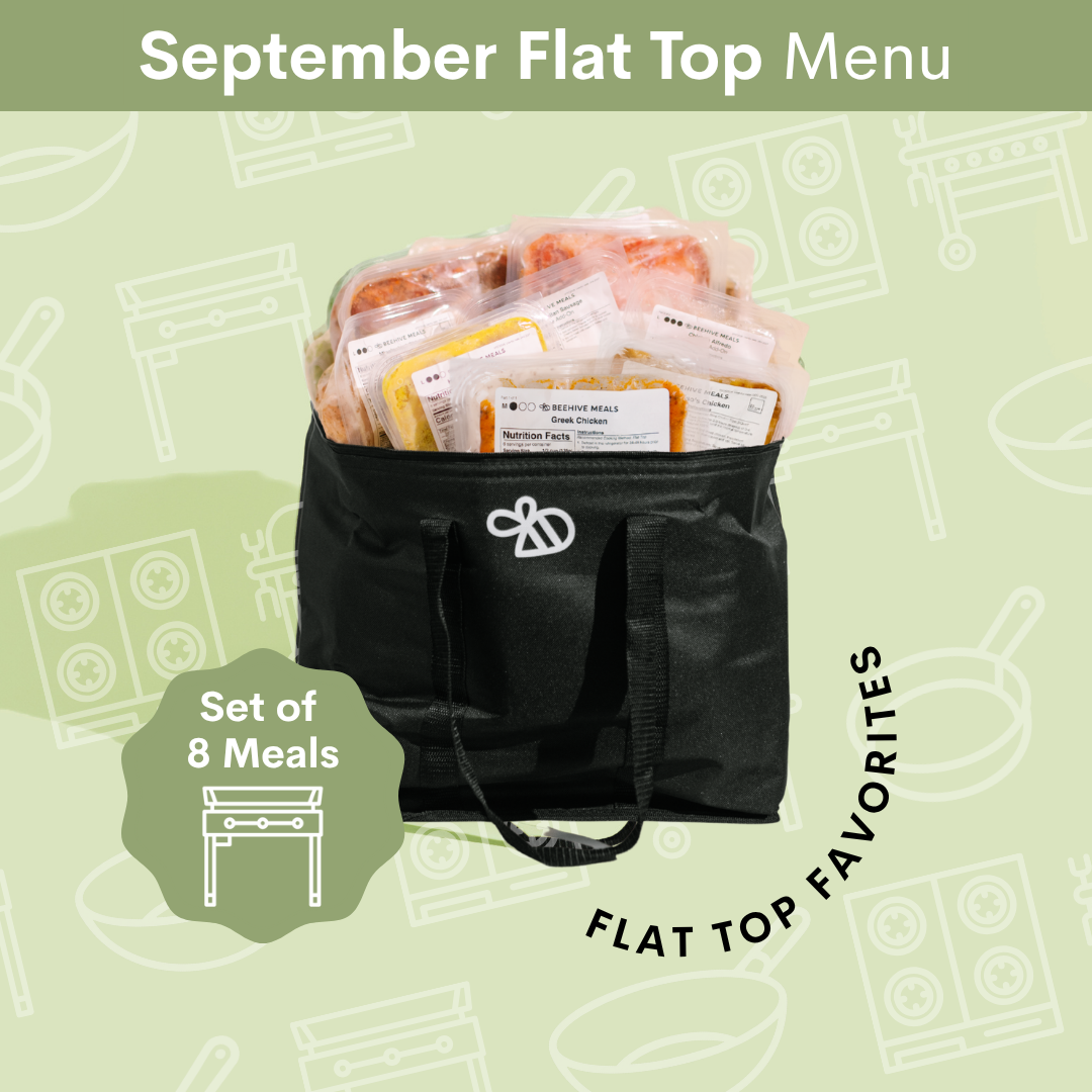 A black insulated flat-top bag filled with packaged meals, shown on a light green illustrated background with the text 'September Flat Top Menu' and 'Set of 8 Meals'.