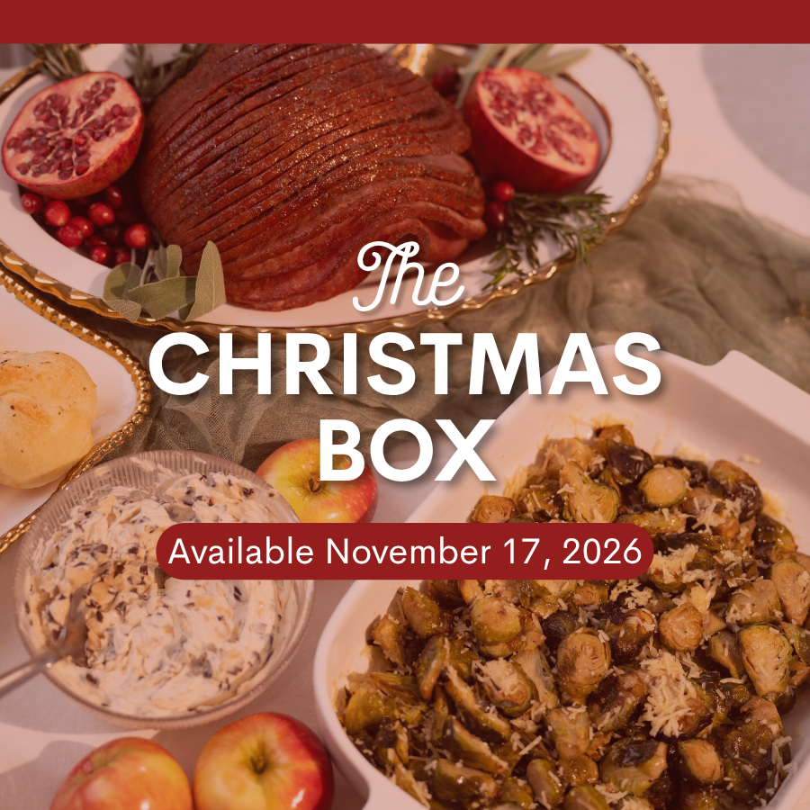 A photo of Christmas Dinner with the text "The Christmas Box Available November 17, 2026" written on it. 