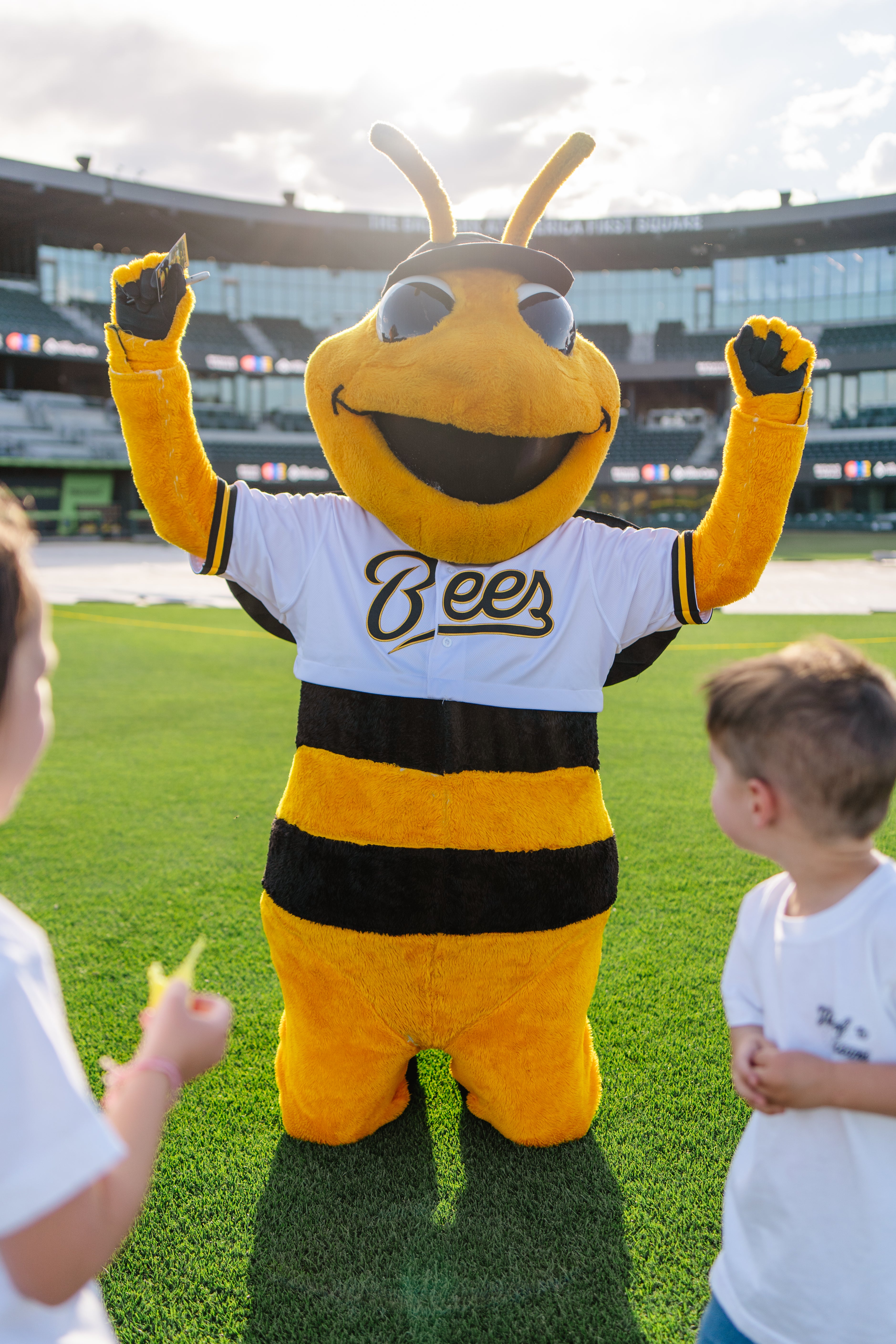 Salt Lake Bee's Bumble entertaining children at a Utah Foster Care event at the Bee's Ballpark